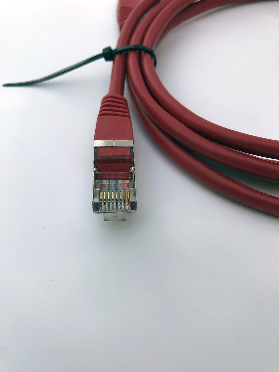 A network cable with a clear connector, representing the link between a light client and a remote machine